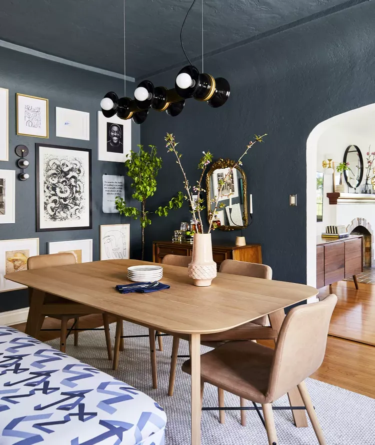 small dining room with walls and ceiling painted dark gray