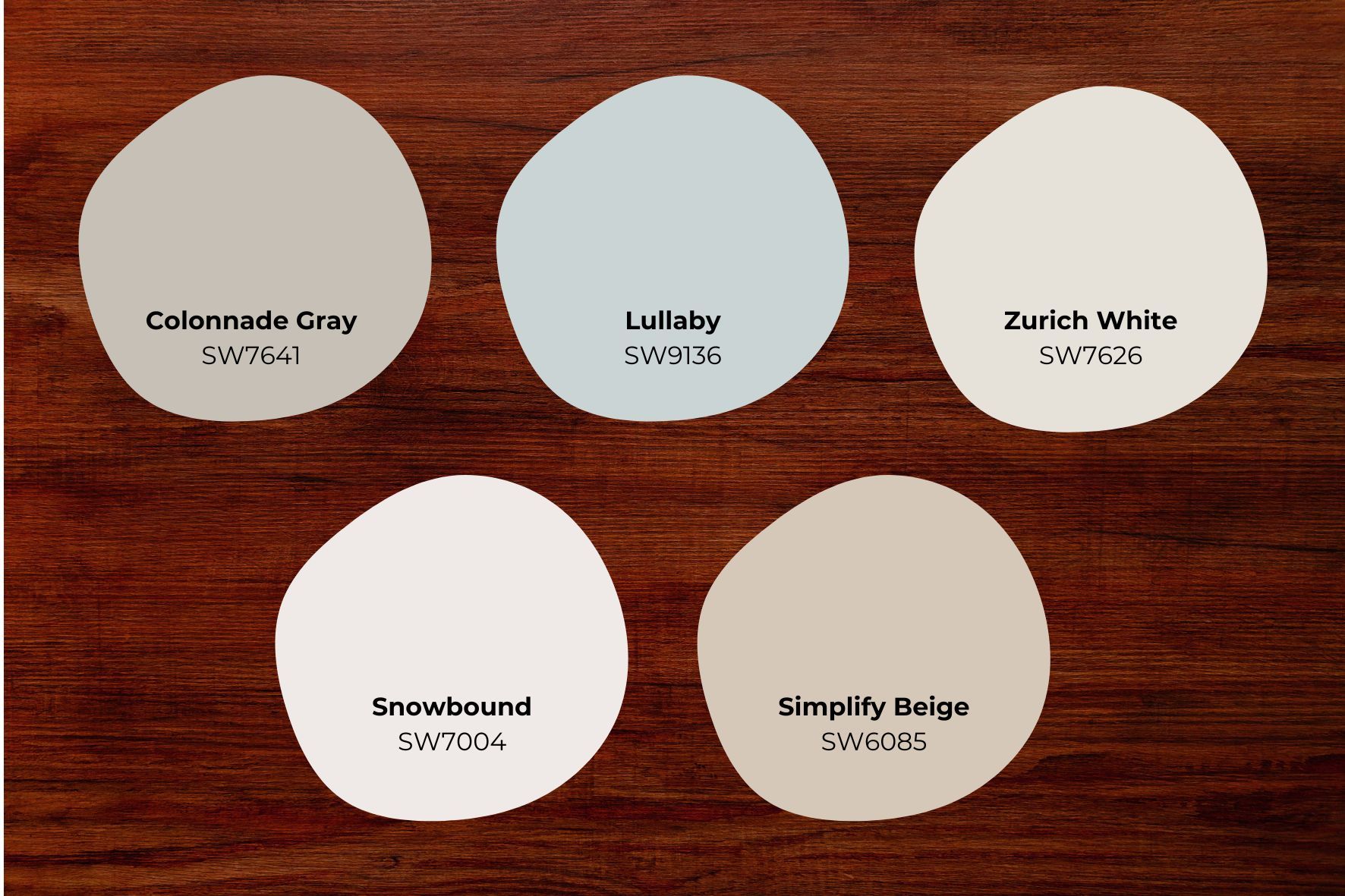 Sherwin-Williams paint swatches on red toned wood floor